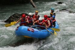 A group of people are rafting down a river.