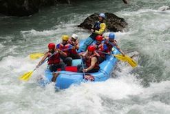 A group of people are rafting down a river.