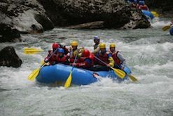 A group of people are rafting down a river.