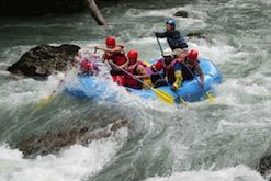 A group of people are rafting down a river.