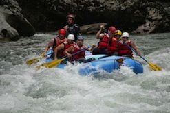 A group of people are rafting down a river.