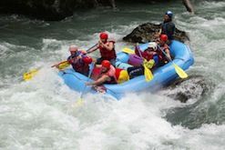 A group of people are rafting down a river.