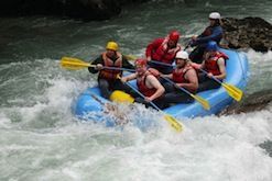 A group of people are rafting down a river.