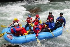 A group of people are rafting down a river.