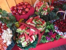 There are many different types of fruits and vegetables on the table.