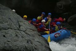 A group of people are rafting down a river.