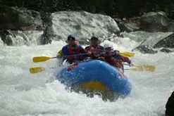 A group of people are rafting down a river.