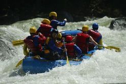 A group of people are rafting down a river.