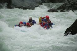 A group of people are rafting down a river.