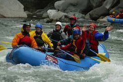 A group of people are rafting down a river.