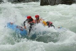 A group of people are rafting down a river.