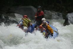 A group of people are rafting down a river.