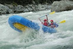 A group of people are rafting down a river.