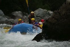 A group of people are rafting down a river.