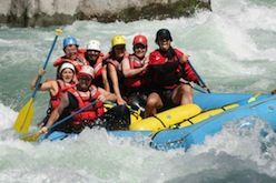 A group of people are rafting down a river.