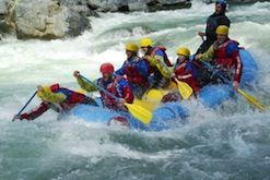A group of people are rafting down a river.