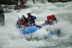 A group of people are rafting down a river.
