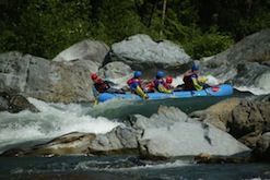 A group of people are rafting down a river.
