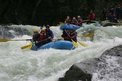 A group of people are rafting down a river.