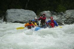 A group of people are rafting down a river.