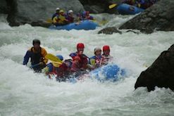 A group of people are rafting down a river.