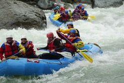 A group of people are rafting down a river.