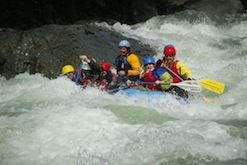 A group of people are rafting down a river.