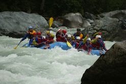 A group of people are rafting down a river.