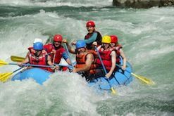 A group of people are rafting down a river.