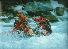 A group of people are rafting down a river.