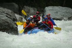 A group of people are rafting down a river.