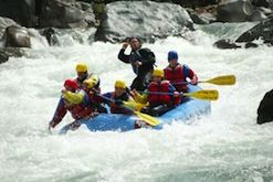 A group of people are rafting down a river.