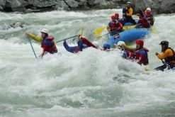 A group of people are rafting down a river.
