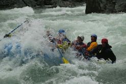A group of people are rafting down a river.