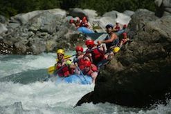 A group of people are rafting down a river.