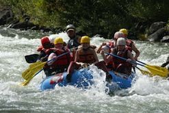 A group of people are rafting down a river.