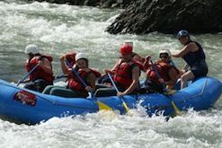 A group of people are rafting down a river.