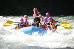 A group of people are rafting down a river.