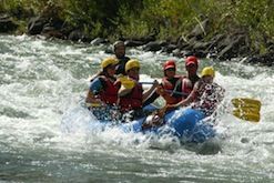 A group of people are rafting down a river.