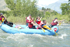 A group of people are rafting down a river.