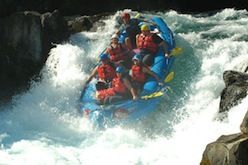 A group of people are rafting down a river.
