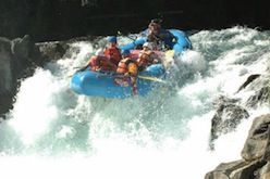 A group of people are rafting down a river.