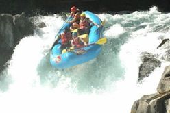 A group of people are rafting down a river.