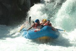 A group of people are rafting down a river.