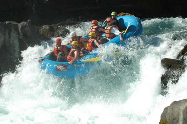 A group of people are rafting down a river.