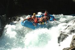 A group of people are rafting down a river.