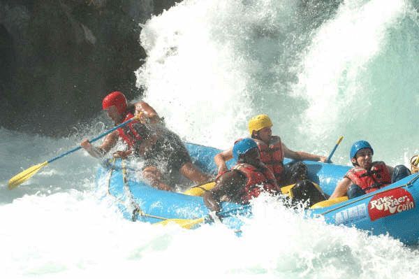 A group of people are rafting down a river.