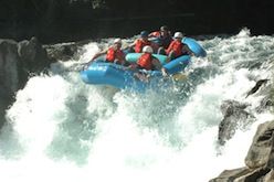 A group of people are rafting down a river.