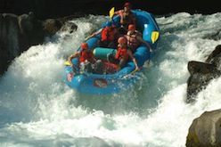 A group of people are rafting down a river.