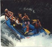 A group of people are rafting down a river.